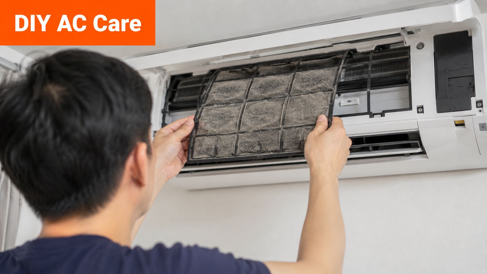 A person removing a dusty and dirty air conditioner filter to perform routine home AC maintenance.